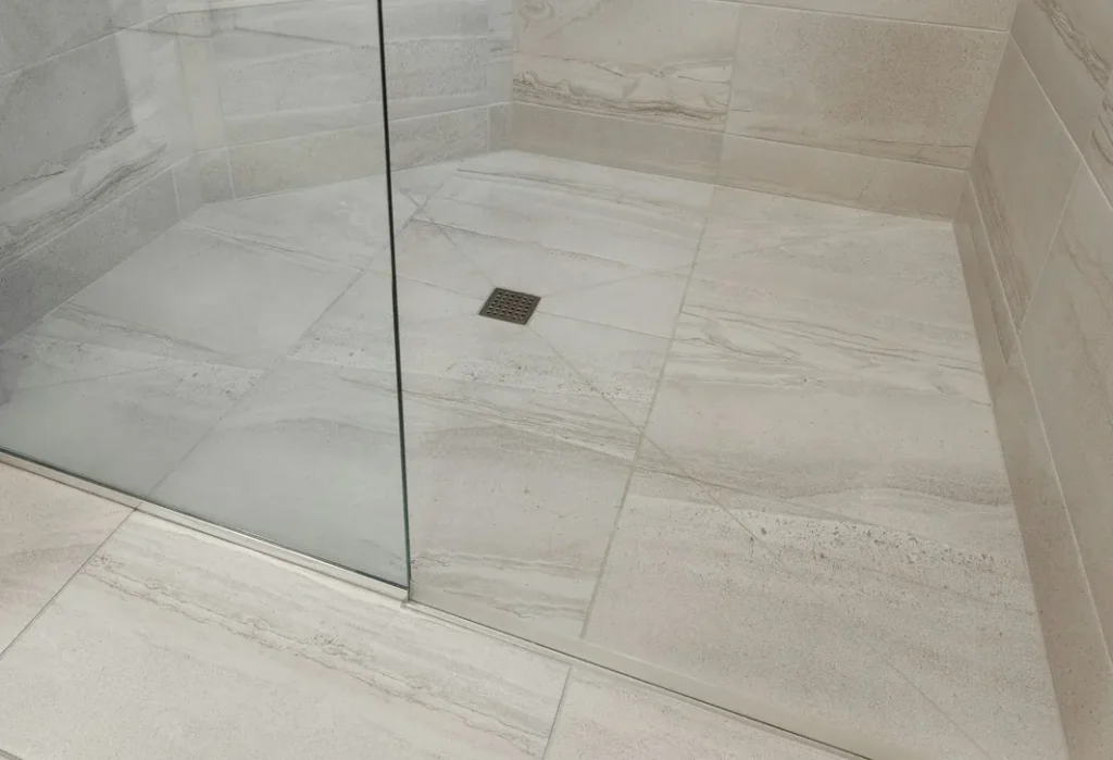 Shower floor set to falls